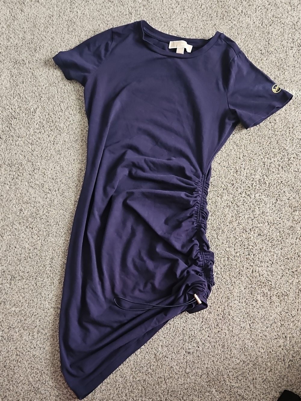 Navy blue Michael Kors T-shirt dress features ruched detailing along the si